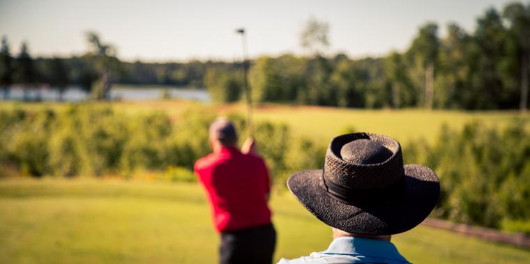A golfer's hat resting on the course