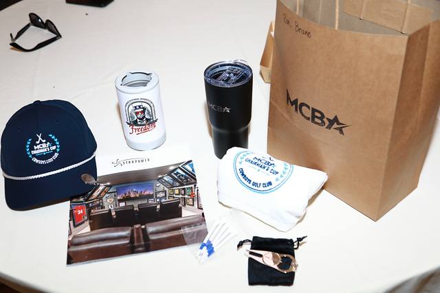 The players' gifts: a Chairman's Cup hat, a can cooler, a tumbler and an MCBA bag