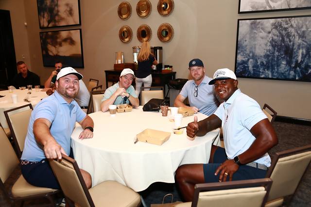 Four players at a breakfast table in the clubhouse