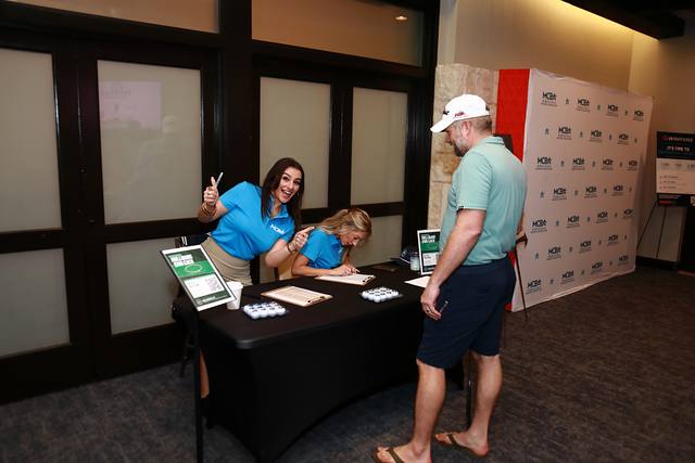 A player checking in at the registration table