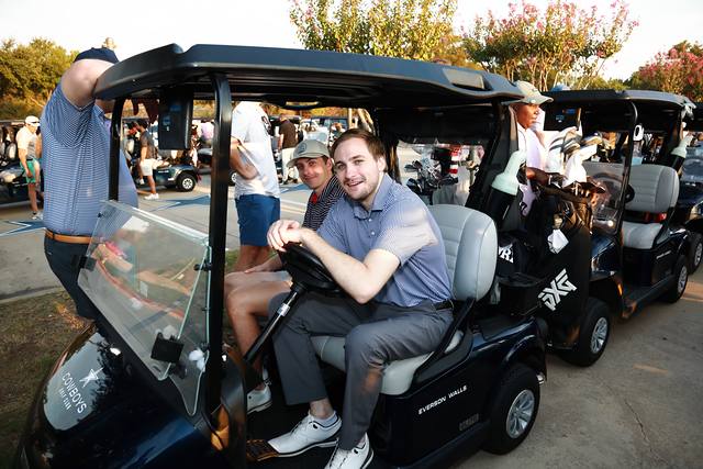 Two players in their cart waiting for the start