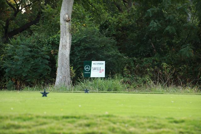 The Saville hole sponsor sign beside a Cowboys star tee marker