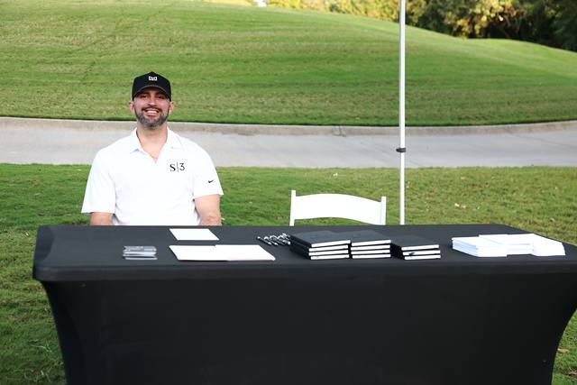 A sponsor from S3 at his table on the course