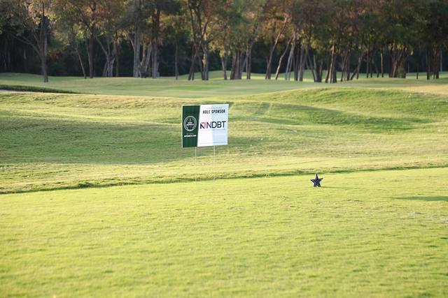 The North Dallas Bank & Trust hole sponsor sign on a tee box