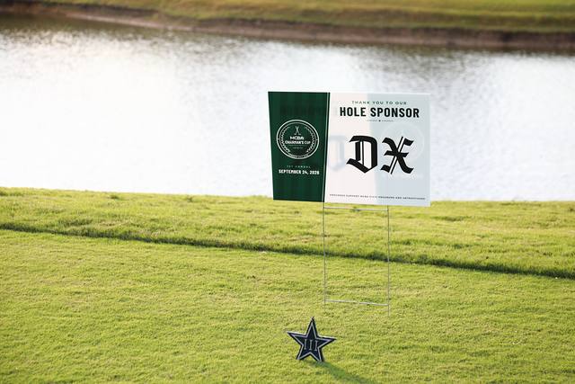 The Dallas Express hole sponsor sign beside a Cowboys star tee marker