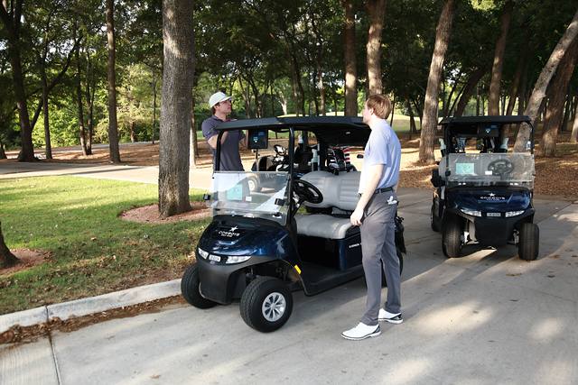 A player waiting beside a line of carts