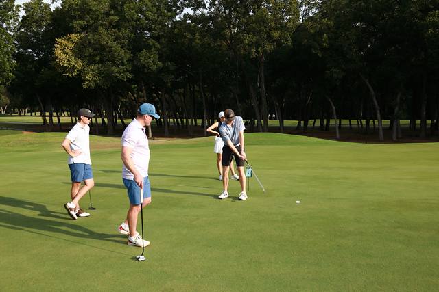 A group walking across a green