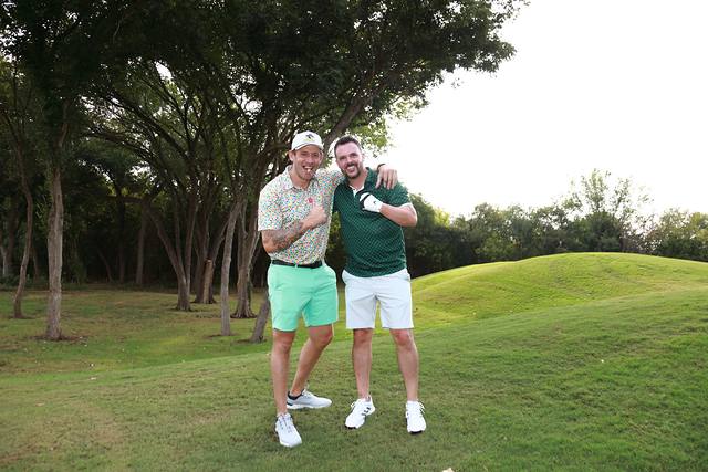Two players posing on the course