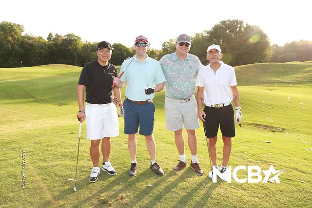 A group posing on the course