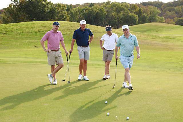 A group walking onto a green