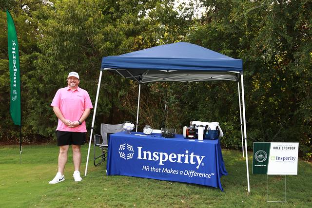 Insperity's tent and hole sponsor sign on the course