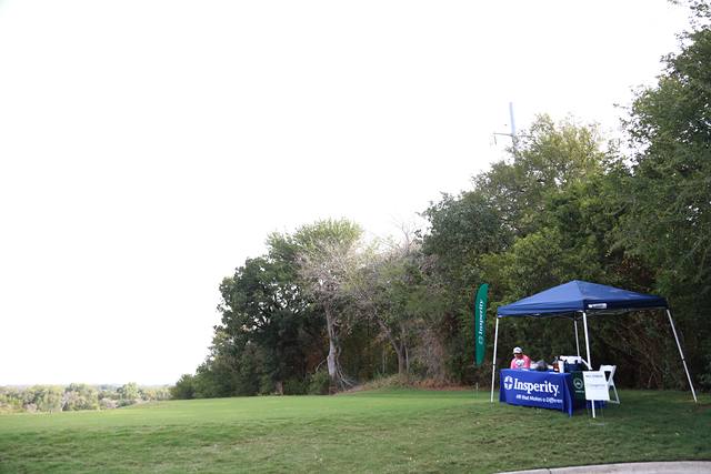 Insperity's tent along the tree line