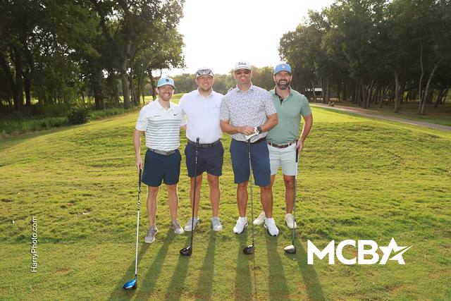 A group posing on a fairway