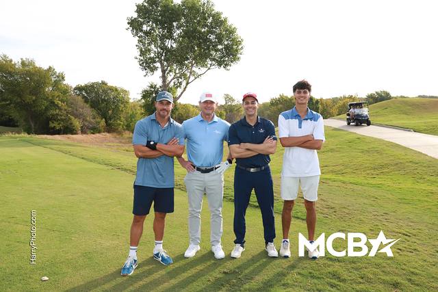 A group posing near the cart path