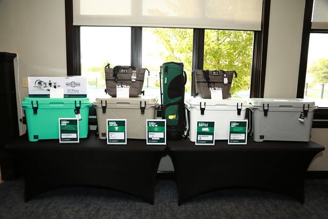 Bison coolers and golf bags on the prize table