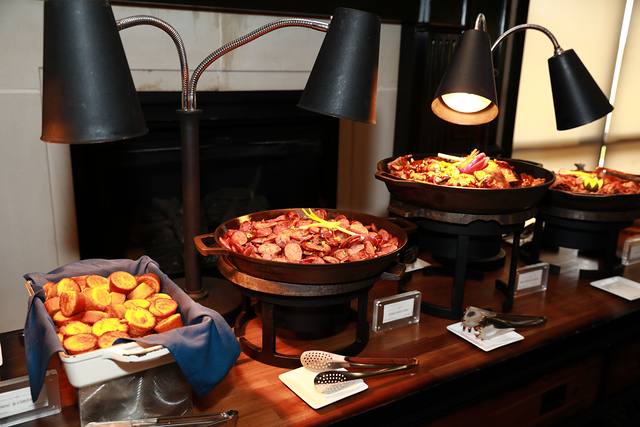 Sausage and grilled peaches on the barbecue buffet