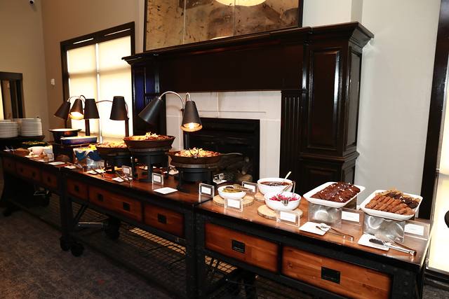 The buffet line along the clubhouse fireplace