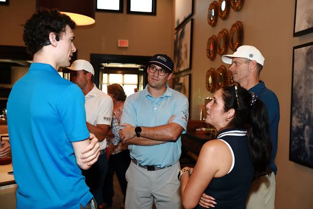 Guests talking in the clubhouse