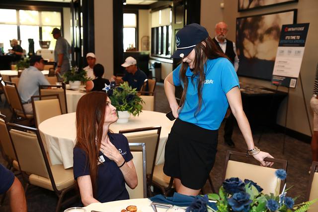 An MCBA team member visiting a lunch table