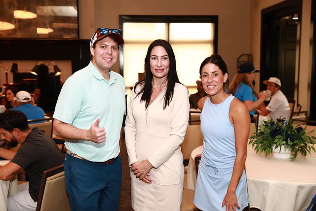 Three guests posing during lunch