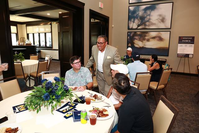 Players eating at a round table