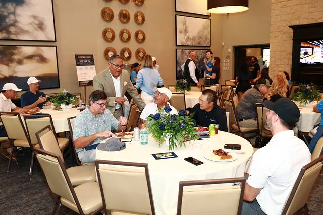 Players eating lunch at a round table