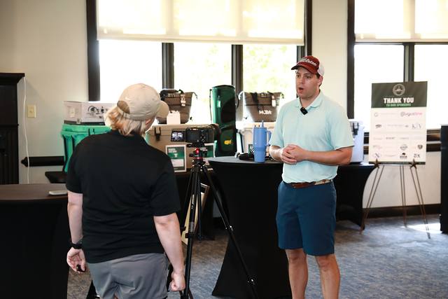 A video being filmed beside the prize table