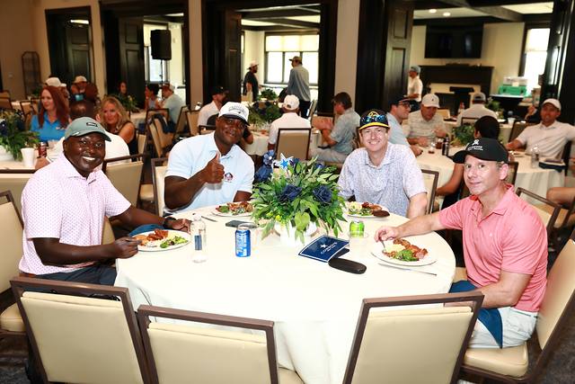 Players laughing at a lunch table