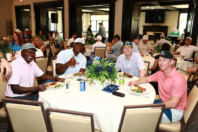 Players at a lunch table during the After Party