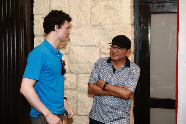 An MCBA team member talking with a guest