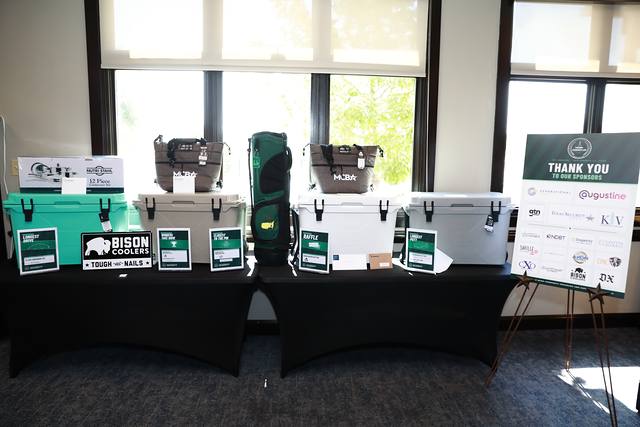 The prize table with Bison coolers and the sponsor thank you sign
