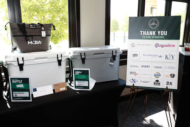 Bison coolers in front of the sponsor thank you sign