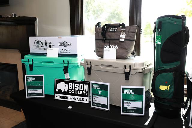 Bison coolers and a golf bag on the prize table