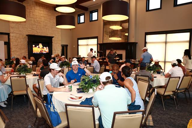 Players at their tables in the dining room