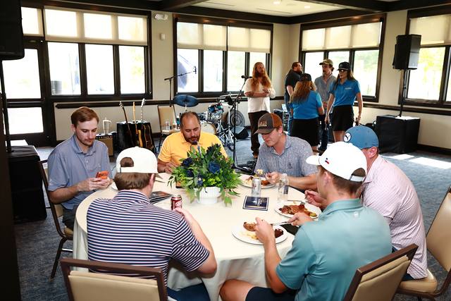 Players eating lunch in the clubhouse