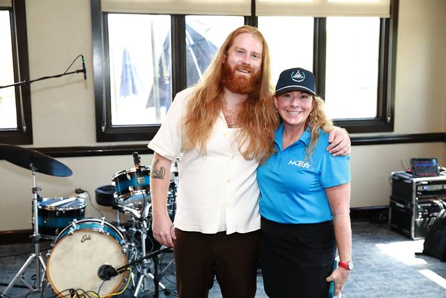 Mitchell Ferguson with an MCBA team member before his set