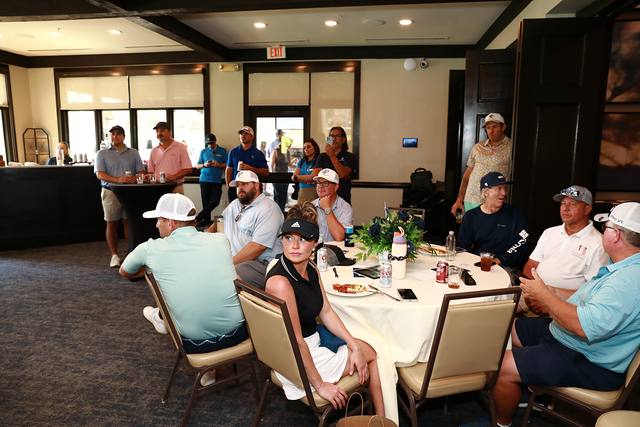 Guests listening to the program from their tables