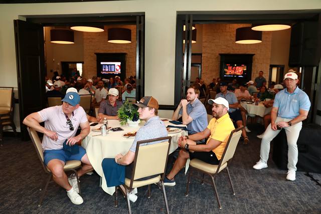 Guests listening at their tables