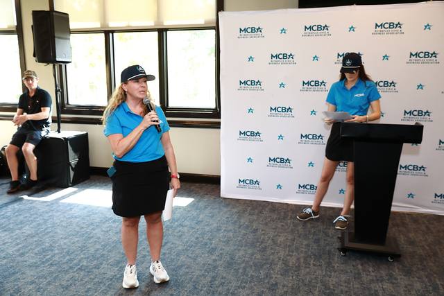 MCBA team members announcing the winners