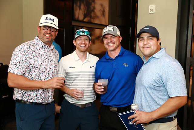 Four players smiling with their drinks