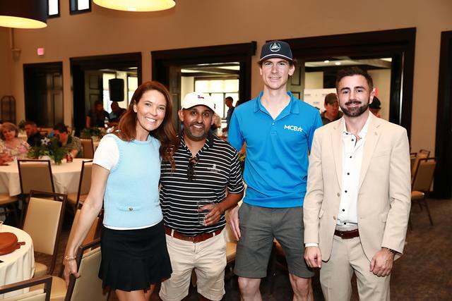 Four guests posing together at the After Party